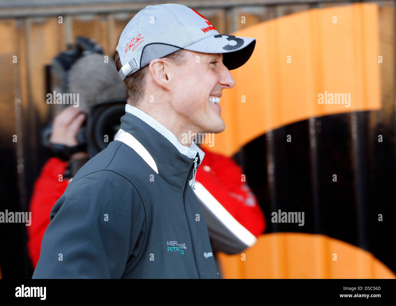German Formula One record world champion Michael Schumacher smiles at