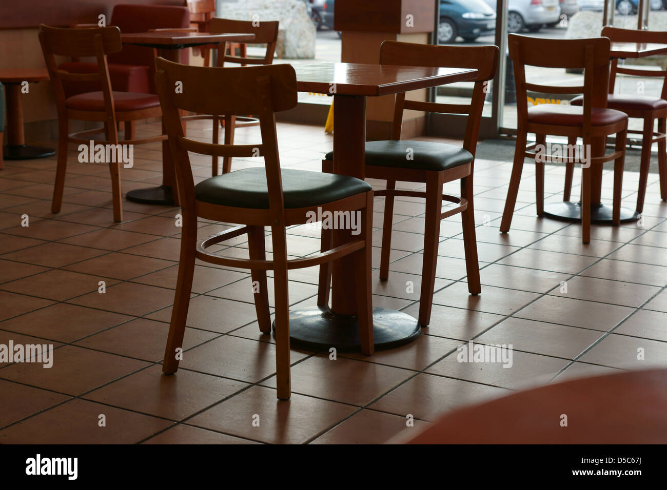 Fast food restaurant tables chairs  inside Stock Photo