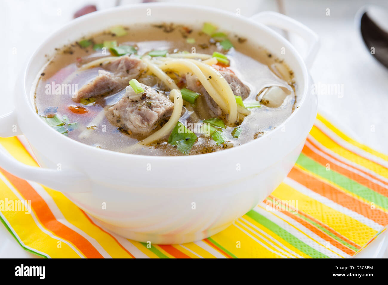 nutritious meat soup in a white tureen, closeup Stock Photo Alamy