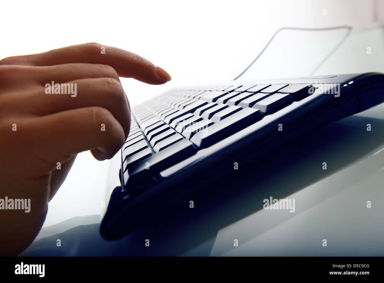 hand press a key on keyboard Stock Photo Alamy