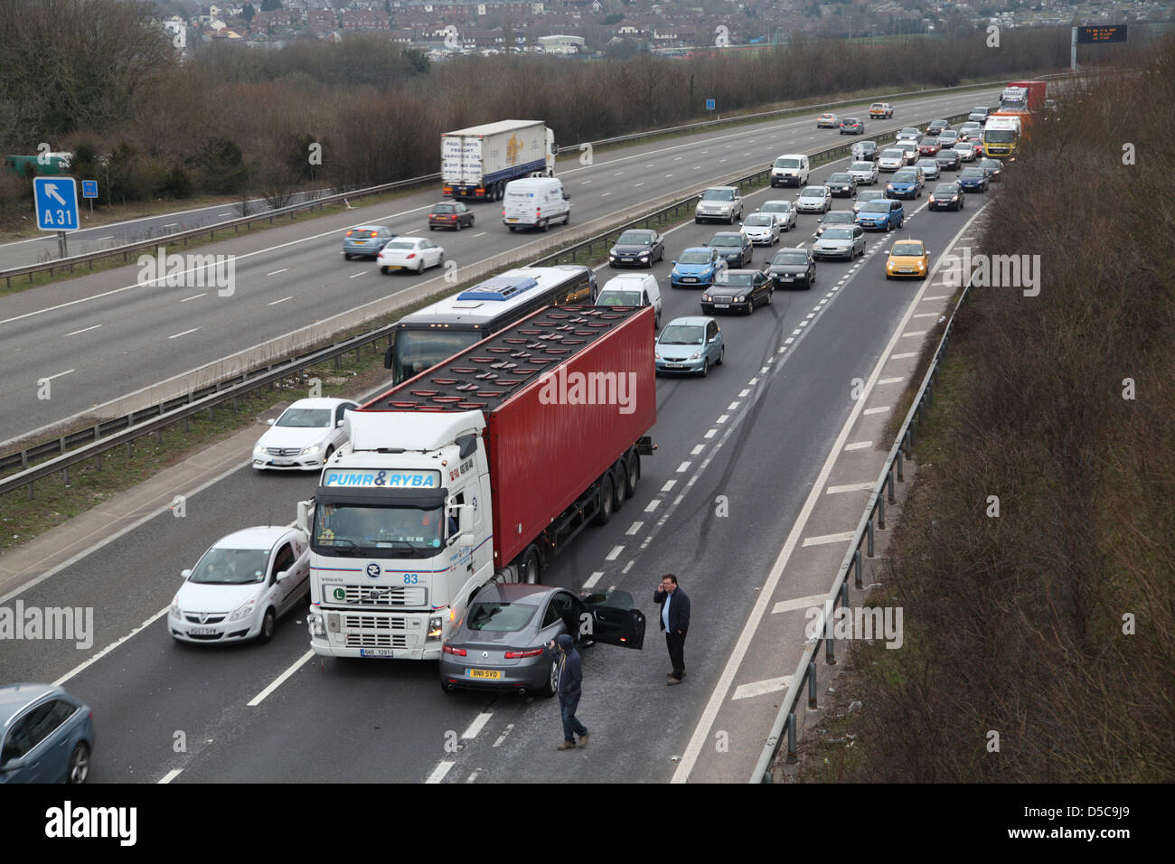 Winchester,UK. 28 March 2013 - An incident on the M3 motorway between Jct. 10 & 11 in Hampshire involving an articulated lorry and a Renault Laguna. Nobody appeared to be injured but the incident caused tailbacks for an hour. Stock Photo