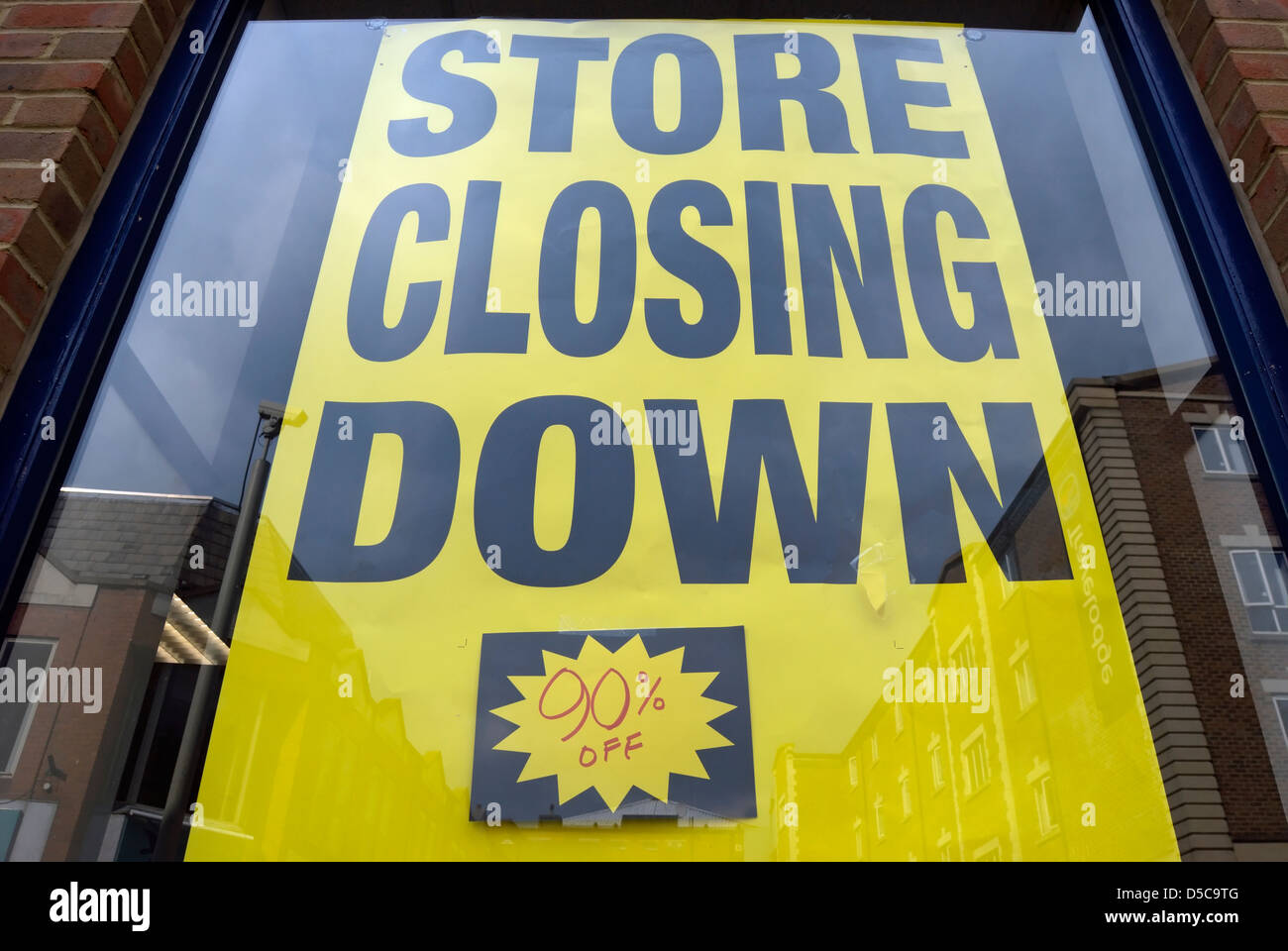 store closing down poster in shop window, kingston upon thames, surrey, england Stock Photo