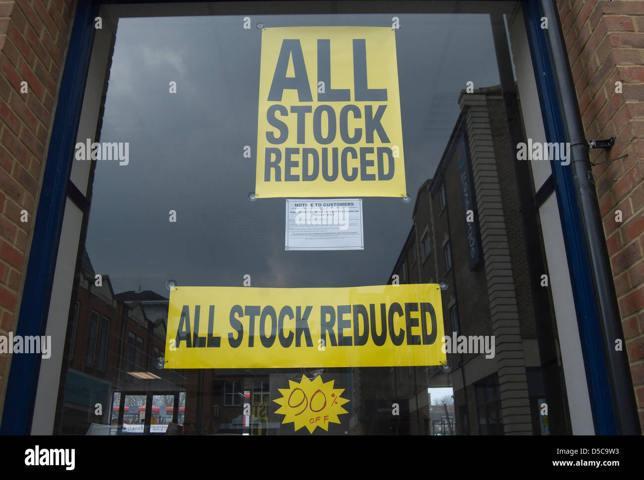 all stock reduced poster in shop window, kingston upon thames, surrey
