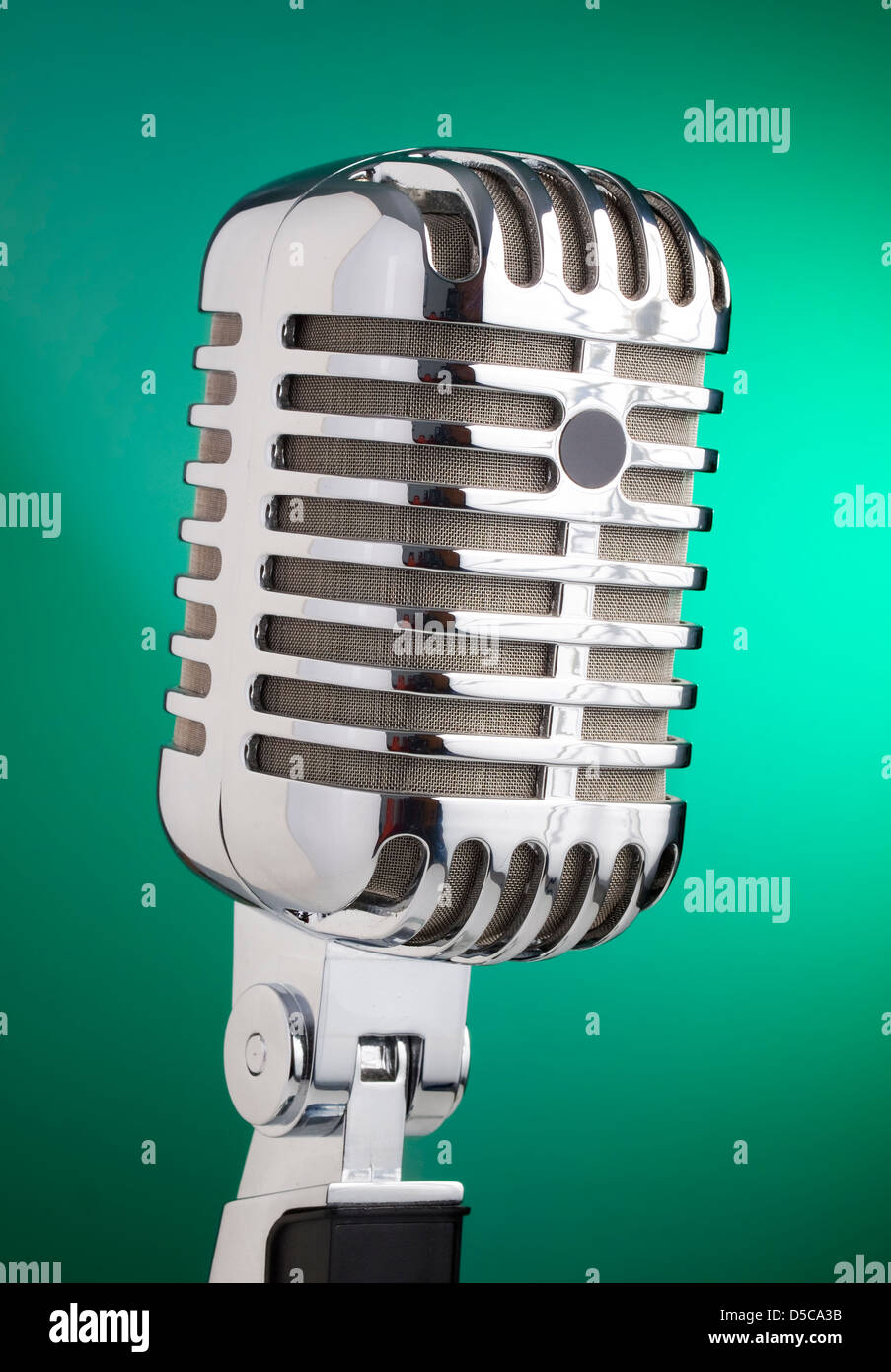 Classic microphone isolated on green background Stock Photo