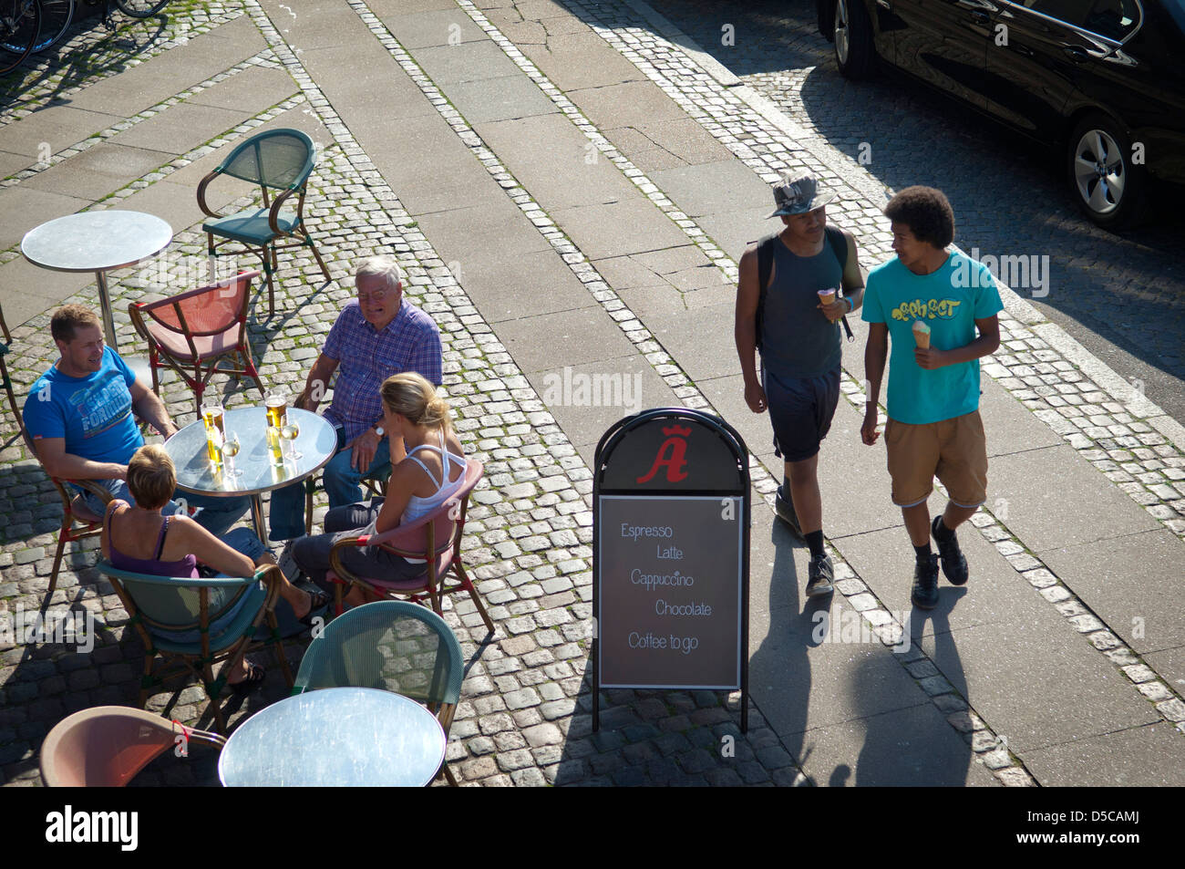 People relaxing in outdoor cafe on Islands Brygge in Copenhagen city, Denmark. Stock Photo