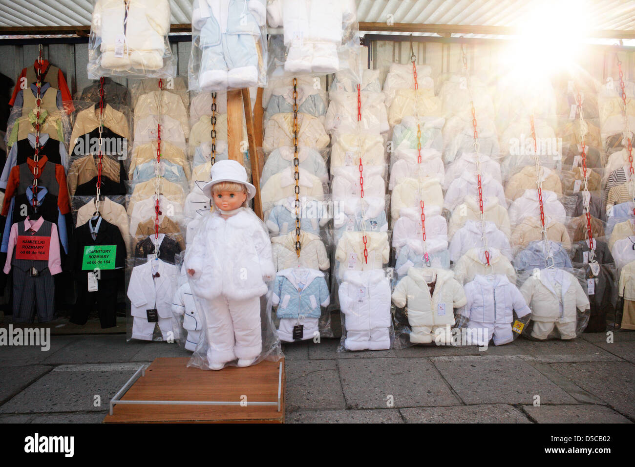 Warsaw, Poland, kids doll at a market stall with kids clothes Stock Photo -  Alamy
