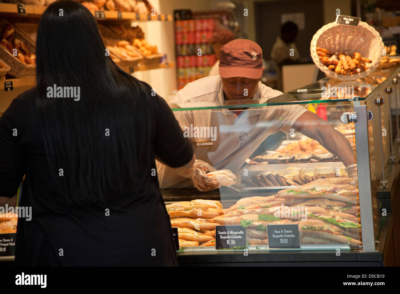 Woman at Sandwich and Bakery Store in Cape Town South africa Stock