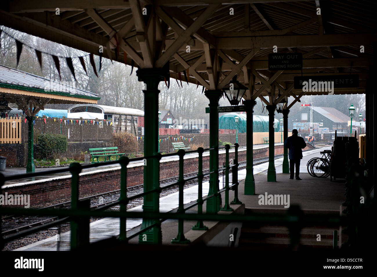 Kingscote Railway Station, on the Bluebell Heritage Railway, during a heavy snow shower Stock Photo