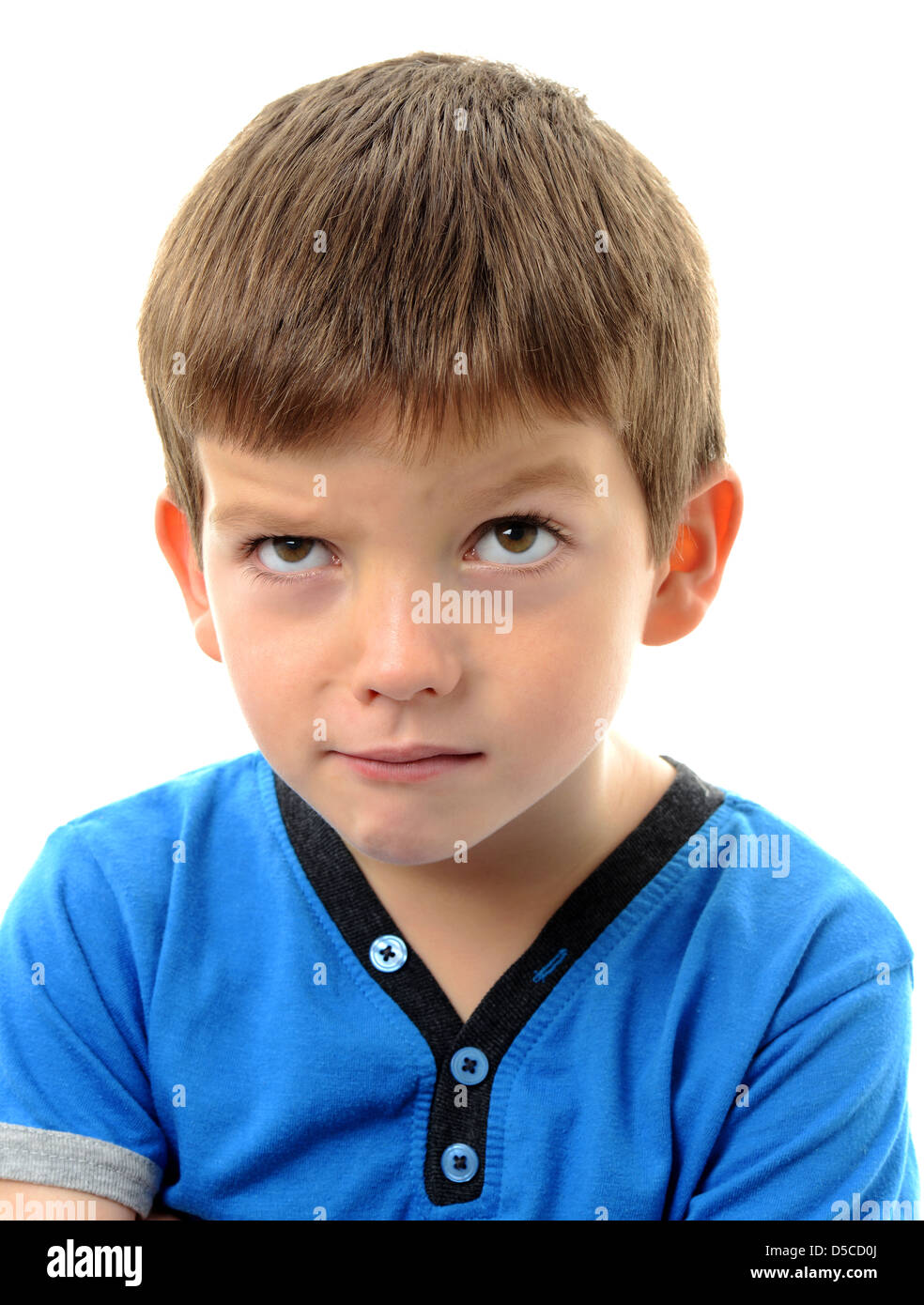 Boy with thoughtful expression, boy in thought Stock Photo