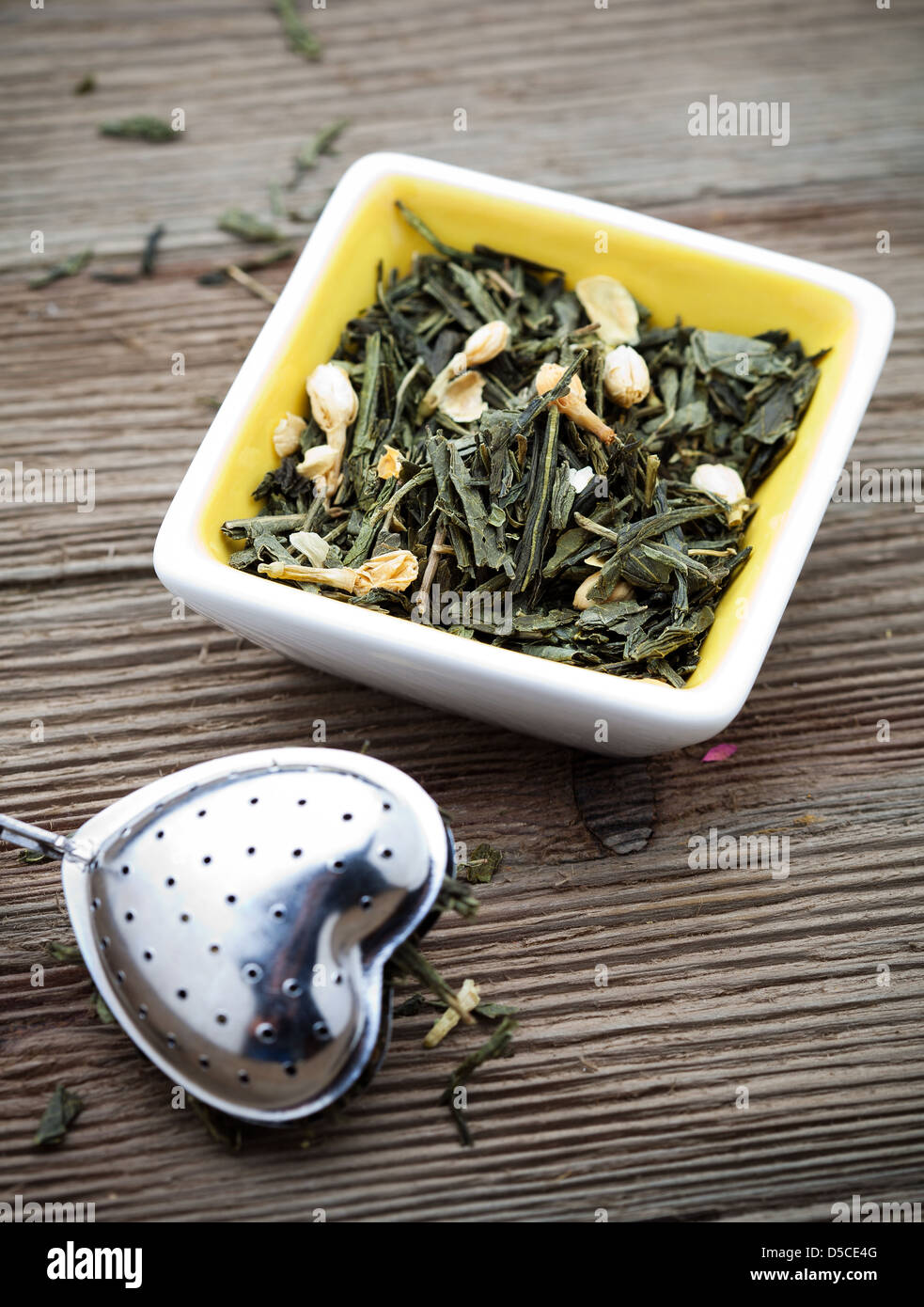 Fresh green tea leaves with jasmine flowers Stock Photo