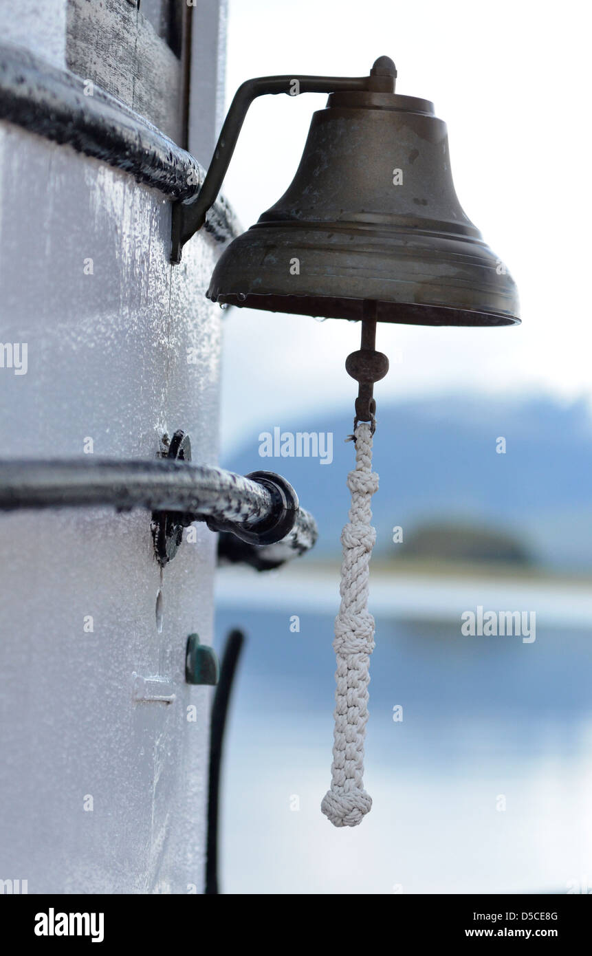 Bell on the David B, a restored wooden boat touring in Alaska. Stock Photo