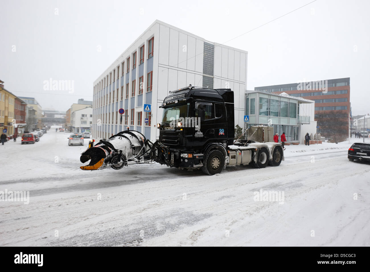 articulated lorry tractor unit fitted with snowplough attachment in hammerfest town centre finnmark norway europe Stock Photo
