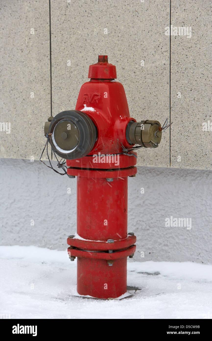 red avk modern dry barrel fire hydrant on street in snow hammerfest