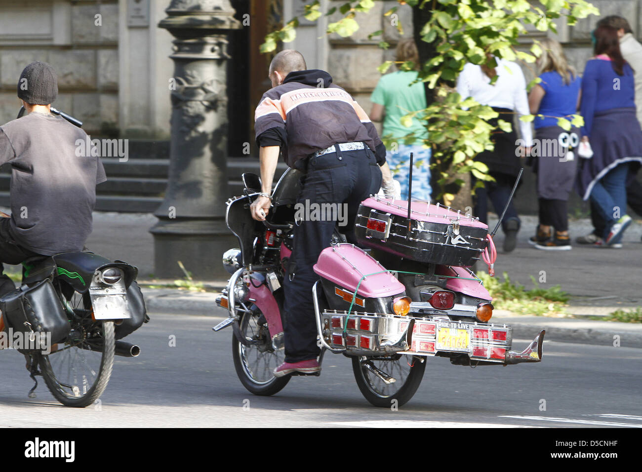 Riders on bicycles designed like chopper motorbikes riding on Unter den ...
