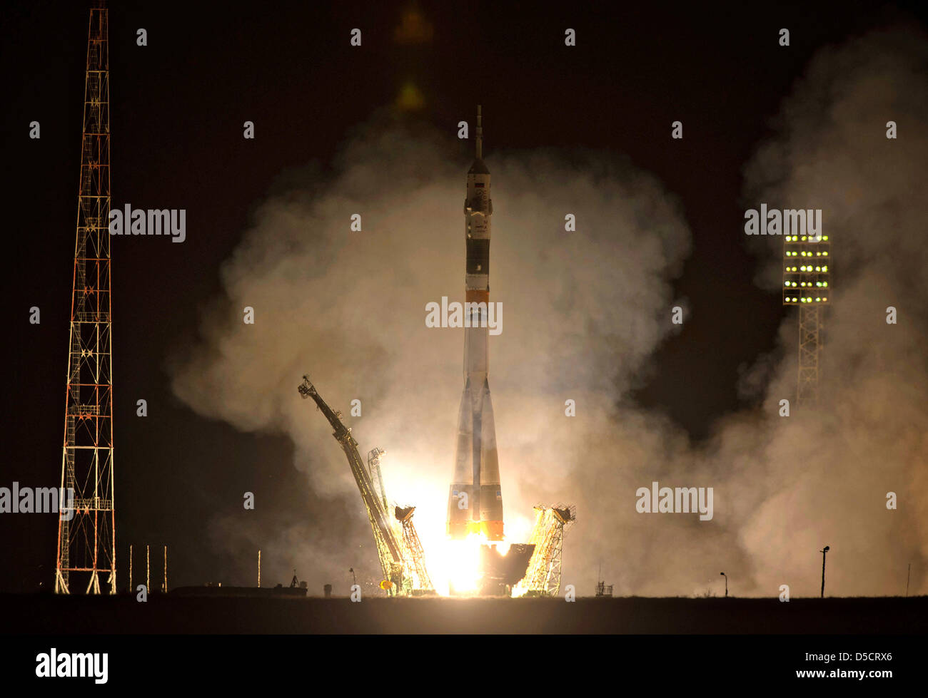 The Soyuz TMA-08M rocket with Expedition 35 crew blasts off to the International Space Station March 29, 2013 in Baikonur, Kazakhstan. The rocket is carrying Soyuz Commander Pavel Vinogradov,  NASA Flight Engineer Chris Cassidy and Russian Flight Engineer Alexander Misurkin to the International Space Station. Stock Photo