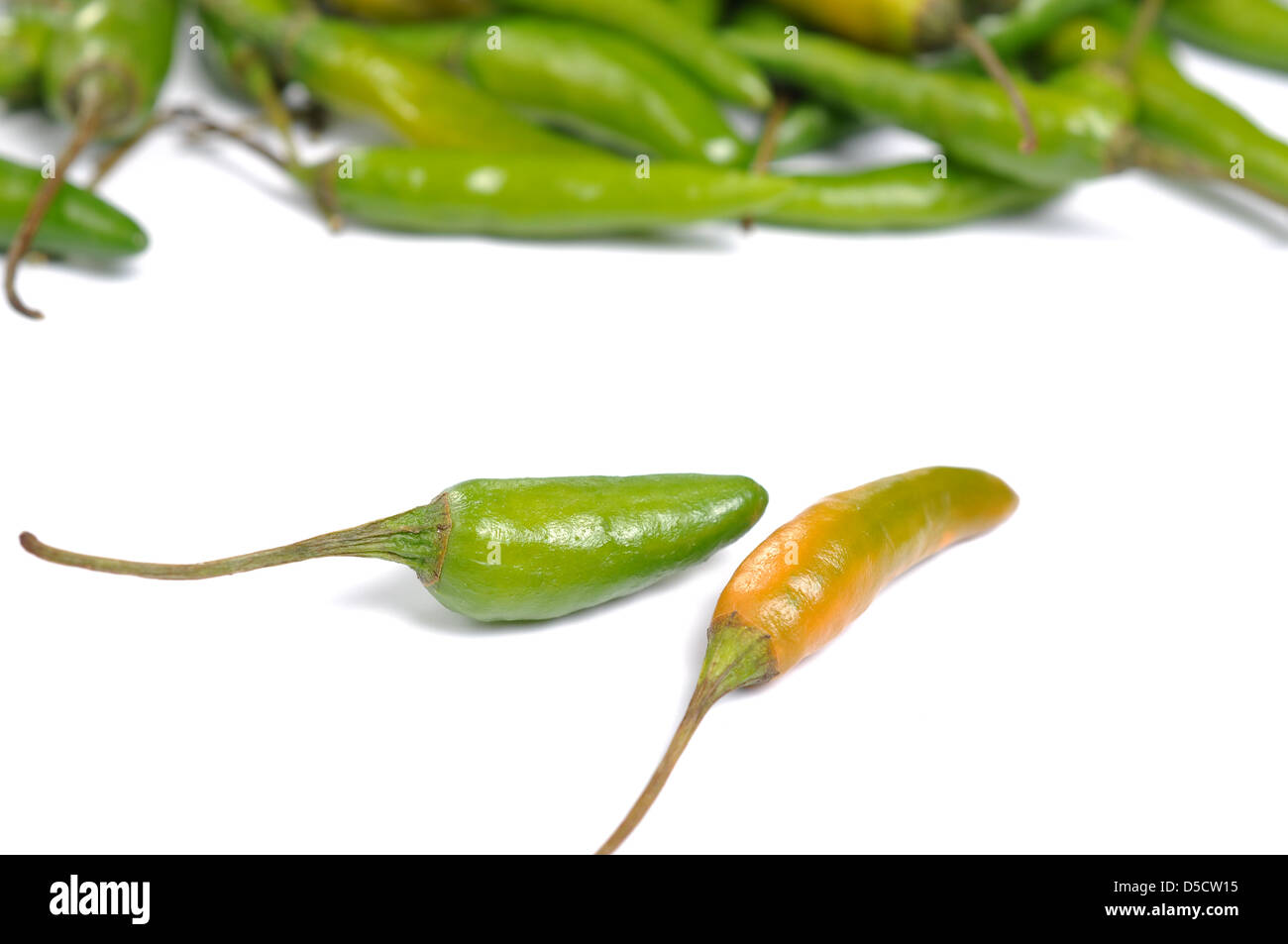 Green hot chili peppers on white background Stock Photo - Alamy