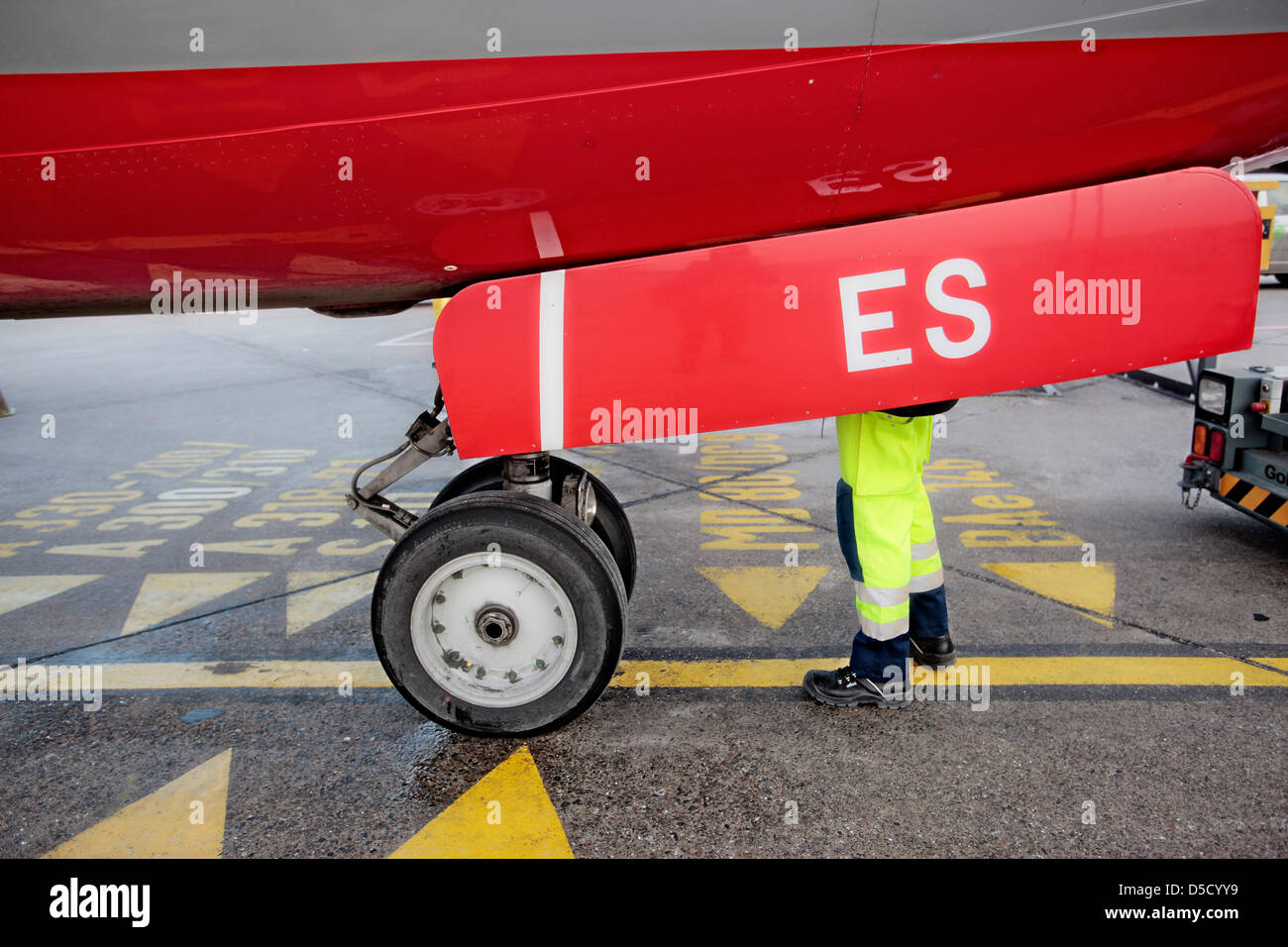 Berlin, Germany, airport ground staff Tegel under an airplane Stock Photo