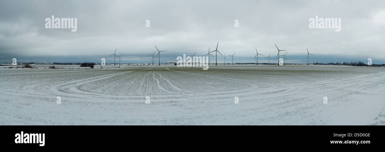 Marienleuchte, Germany, wind wheels and snowy field on the island of Fehmarn Stock Photo