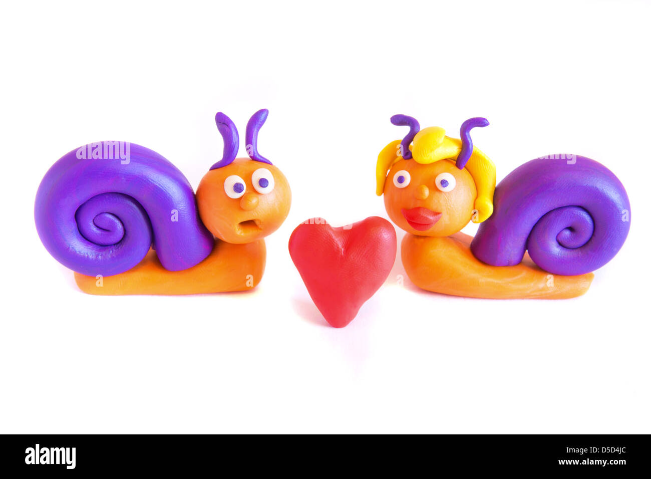 Two funny snails in love clay plasticine modeling isolated on white background Stock Photo Alamy