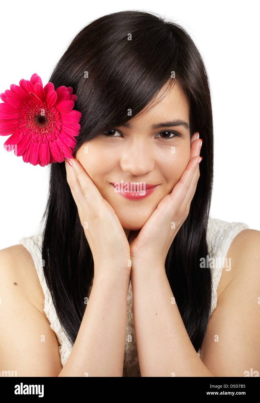 Portrait of a beautiful young woman with a flower in her hair isolated ...