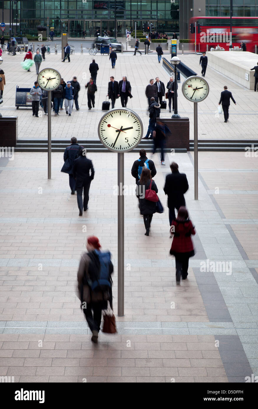 London, United Kingdom, Street Scene with station clocks in the economic hub of Canary Wharf in the Docklands Stock Photo