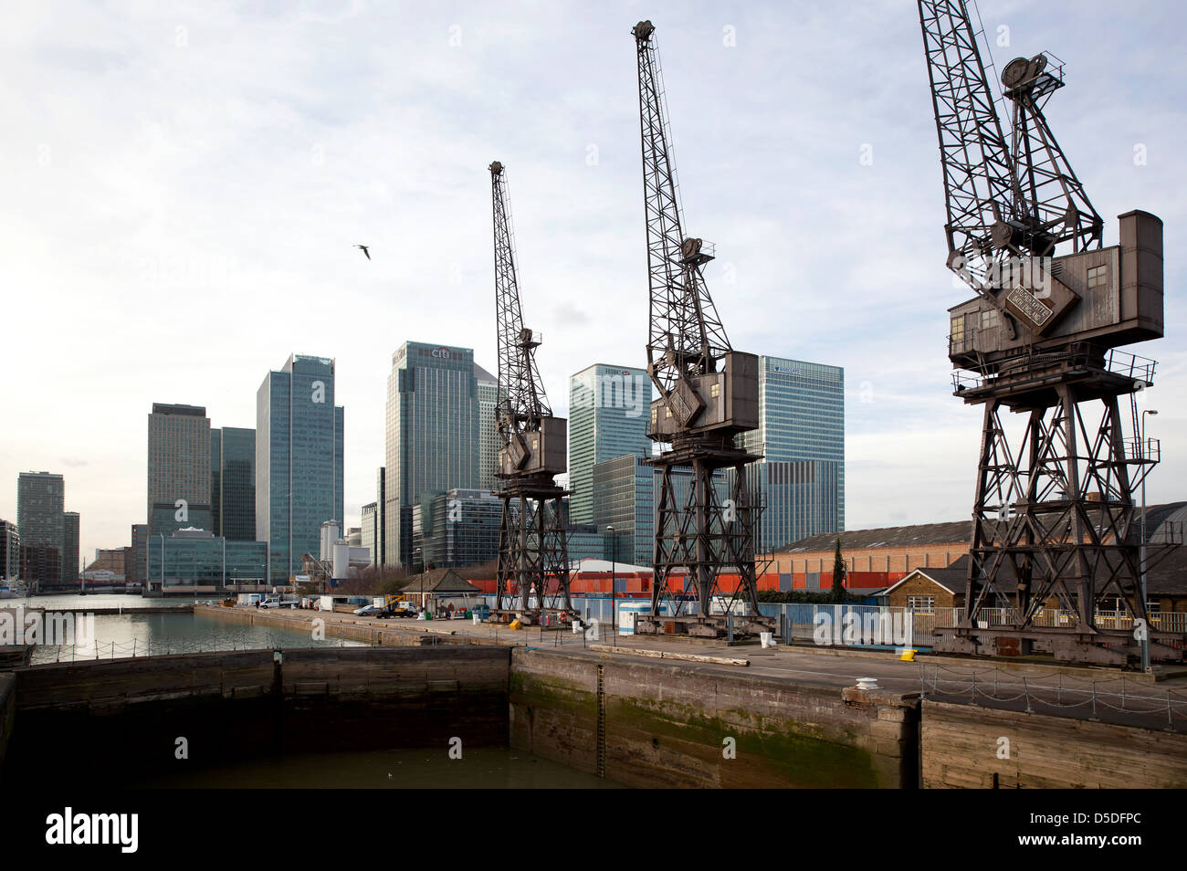 London, United Kingdom, old harbor area of Docklands with the skyscrapers in the business hub of Canary Wharf Stock Photo