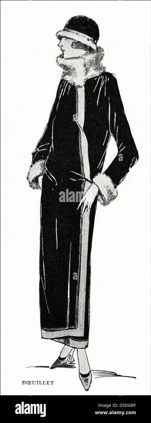 Paris fashion of 1923 by designer Georges Doeuillet. Black satin cloak trimmed with bands of castor (beaver) fur and black cloth. Stock Photo