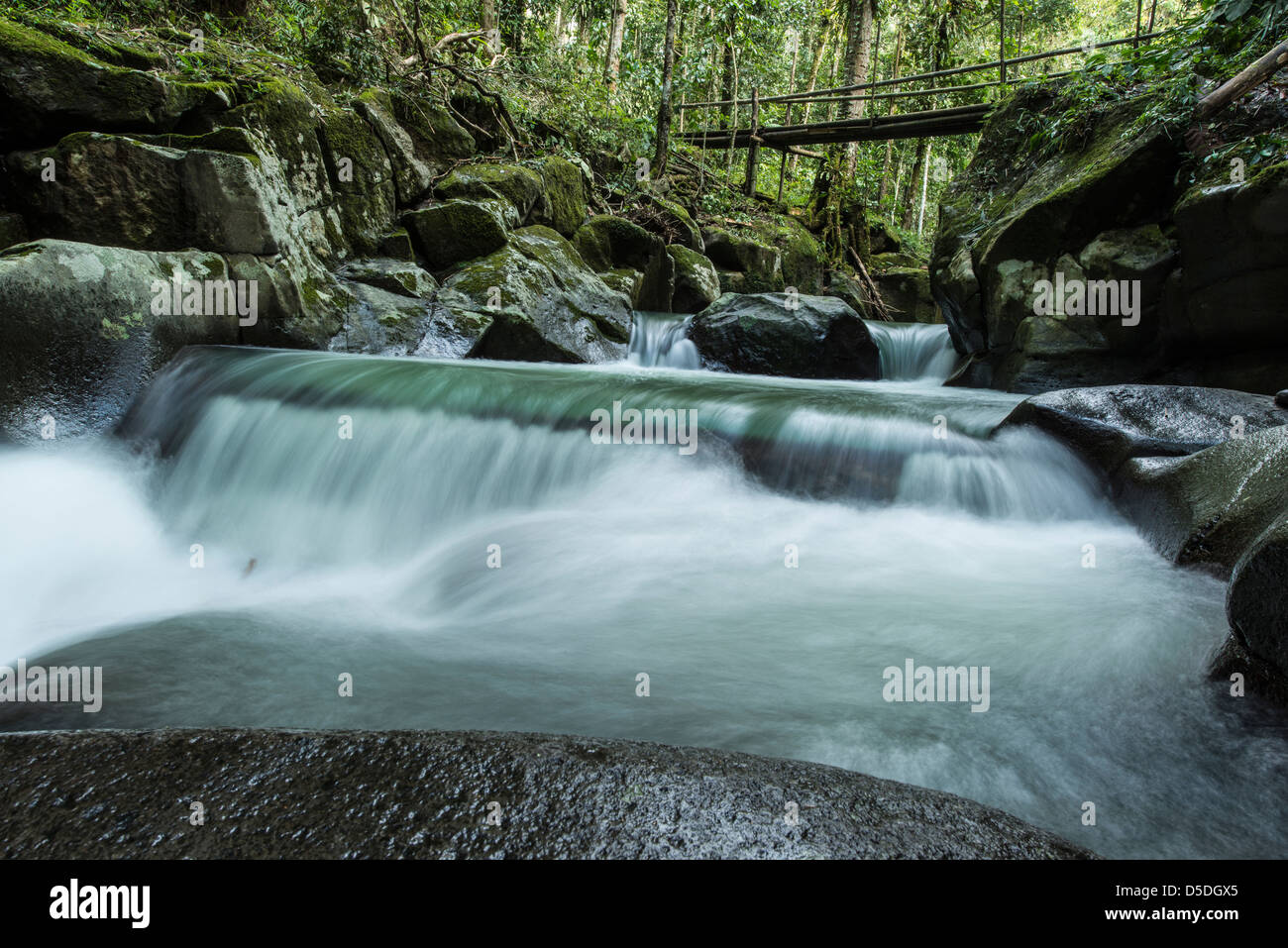 River running through a rocky area with waterfalls Stock Photo - Alamy