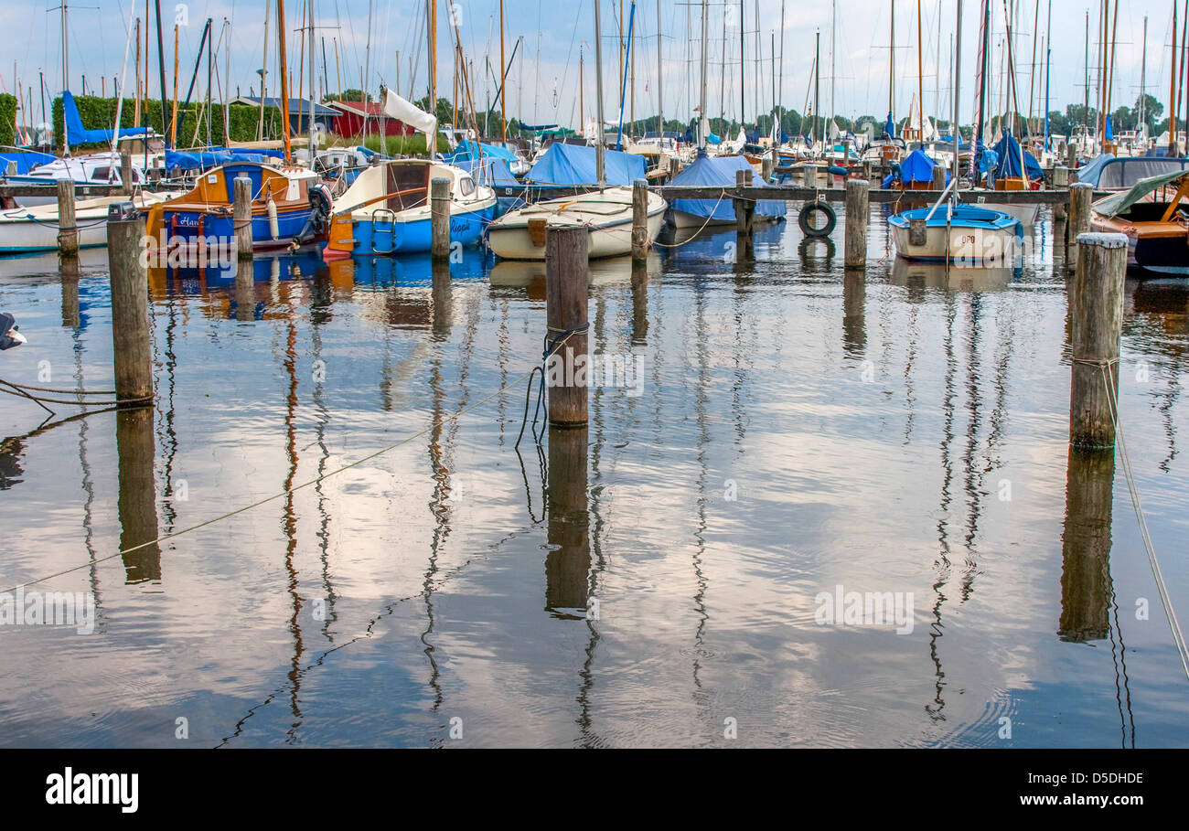 Sailing boats in the harbor with reflection in the water Stock Photo ...