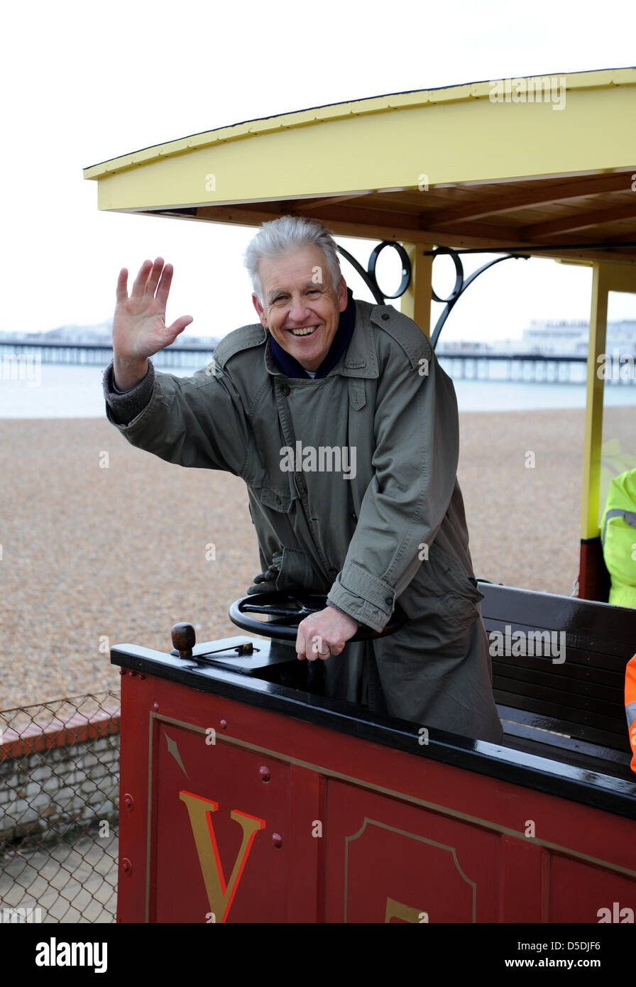Brighton, Uk. 29th March, 2013.  BBC television newsreader Nicholas owen takes the wheel for the Volk's Railways first journey of the summer season on Brighton seafront today Photograph taken by Simon Dack/Alamy Live News Stock Photo
