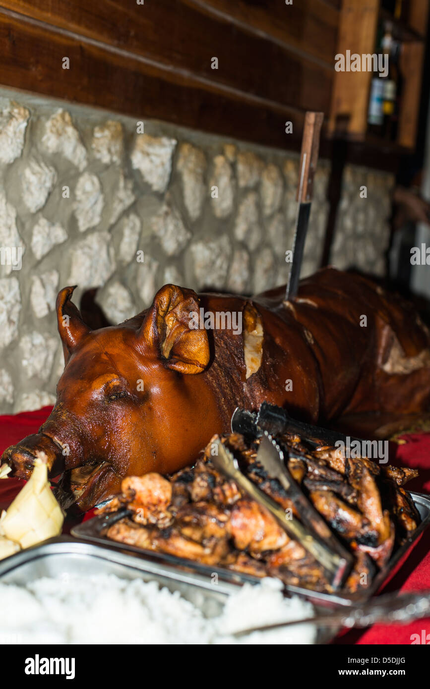 Christmas dinner with a whole roasted pig Stock Photo Alamy