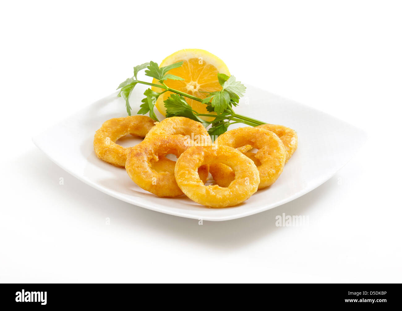deep fried breaded calamari rings in a white background Stock Photo - Alamy