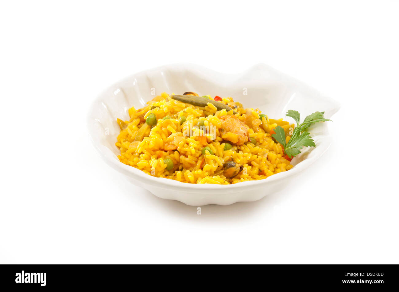 traditional Spanish plate (paella) made of rice, spices, seafood, chicken, vegetables e.t.c. Stock Photo