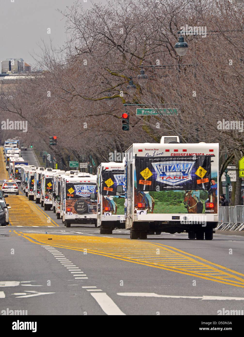 Mitzvah Tanks parading up Eastern Parkway to celebrate the birthday of the Lubavitcher Rebbe Menachem Mendel Schneerson. Stock Photo