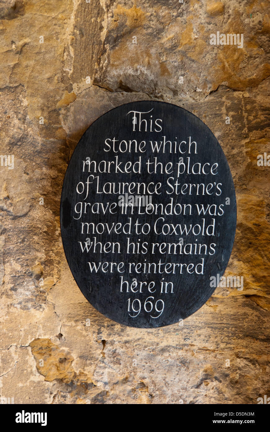 Sign regarding the writer Laurence Sterne's grave situated in the porch of St Michael's church, Coxwold Stock Photo