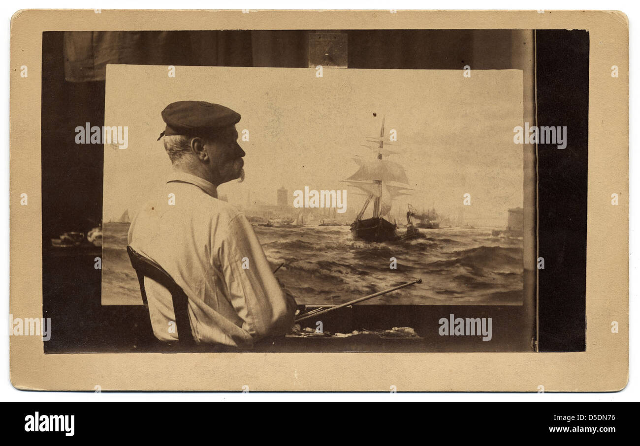 Edward Moran, a marine painter, is seen at work in this archival image ...