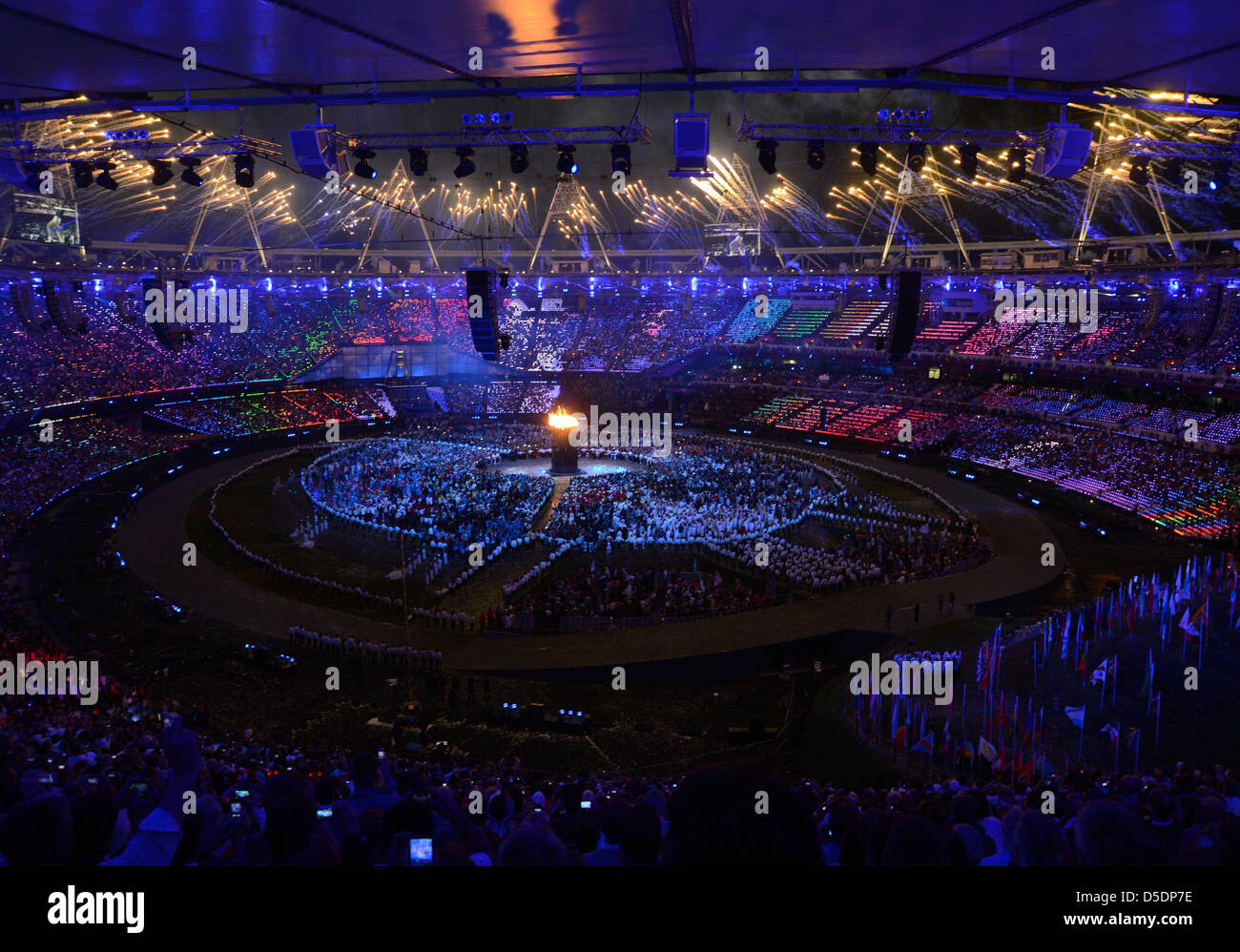 Flame lights crowd 30th olympiad fireworks stadium hi-res stock ...