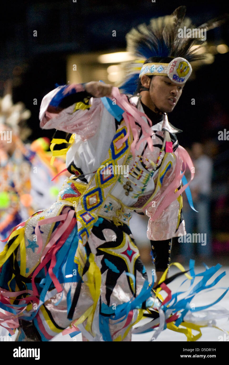 A dancer in colorful regalia performs at a 2007 powwow, celebrating ...