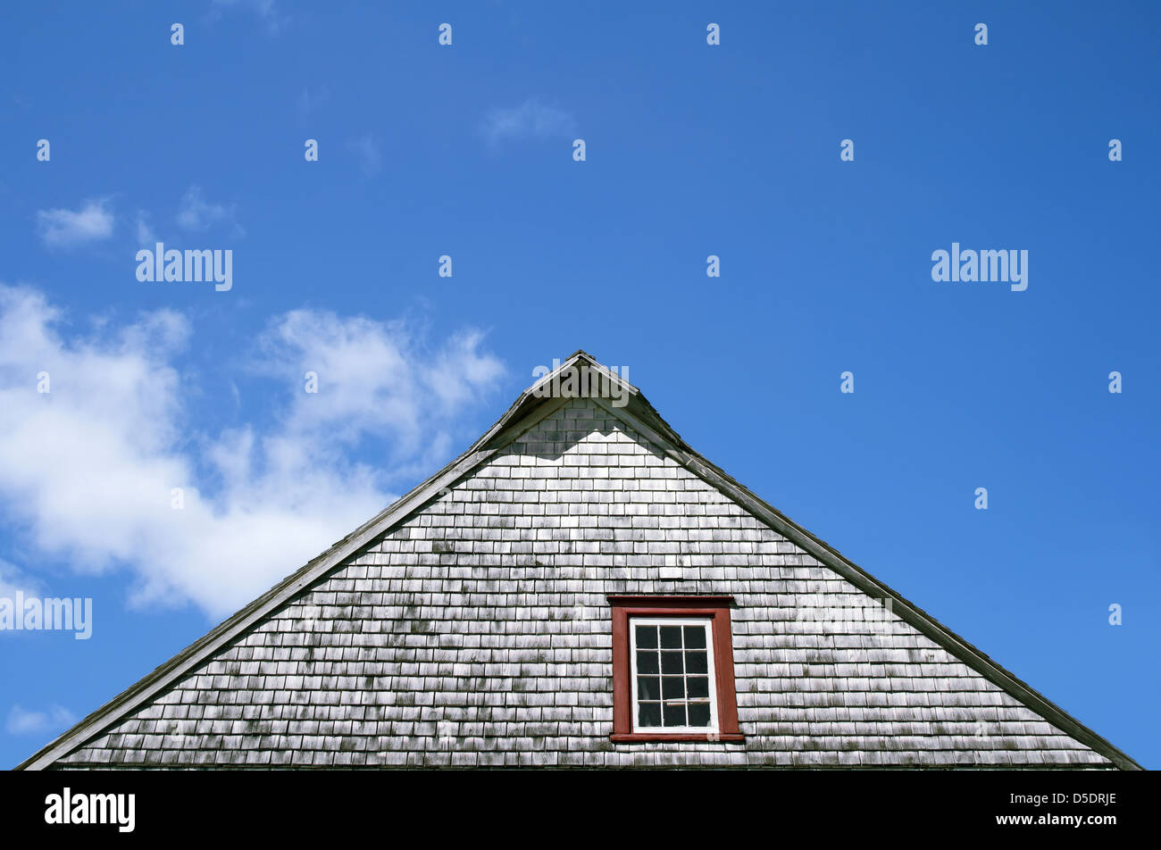 Roof of an old rustic house on blue sky background Stock Photo - Alamy