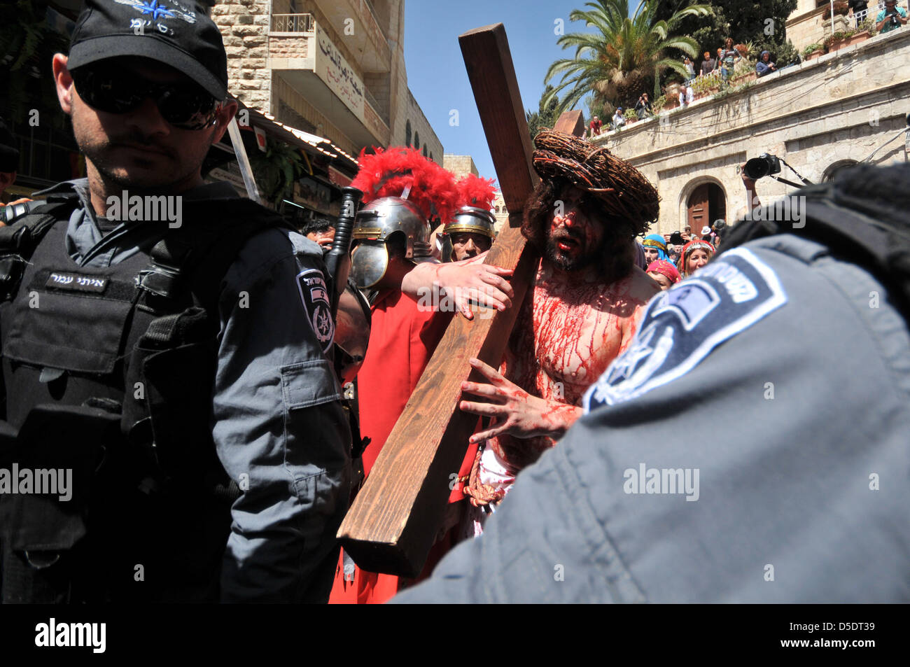 March 29, 2013 - Jerusalem, Jerusalem, Palestinian Territory - An American pilgrim from 'The Hope of Glory' order reenacts the Passion of Christ along the Via Dolorosa during the Good Friday procession on on March 29, 2013 in Jerusalem's Old City. Good Friday is celebrated by Christians throughout the world as the day Christ was crucified on the cross in the lead up to his resurrection on Easter  (Credit Image: © Sliman Khader/APA Images/ZUMAPRESS.com) Stock Photo