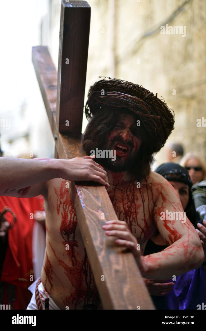 March 29, 2013 - Jerusalem, Jerusalem, Palestinian Territory - An American pilgrim from 'The Hope of Glory' order reenacts the Passion of Christ along the Via Dolorosa during the Good Friday procession on on March 29, 2013 in Jerusalem's Old City. Good Friday is celebrated by Christians throughout the world as the day Christ was crucified on the cross in the lead up to his resurrection on Easter  (Credit Image: © Sliman Khader/APA Images/ZUMAPRESS.com) Stock Photo