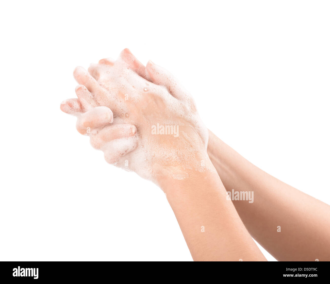 A woman washes her hands with soap. Isolated on white. Stock Photo