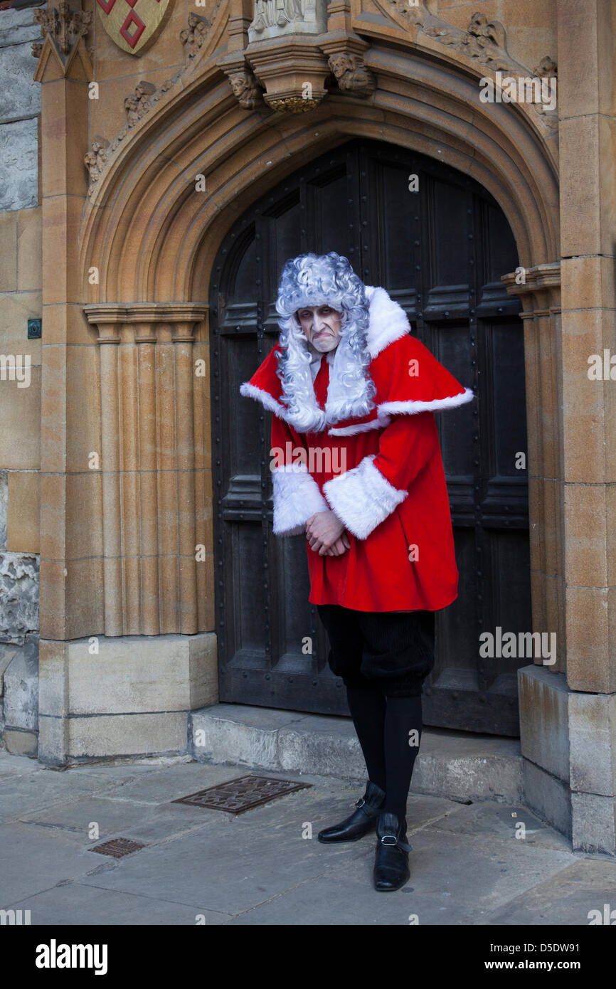 Judicary wearing grey wigs and a red cloak in the City of York, Yorkshire,   Actor James Swanton 22, from York at the annual Easter Crafts and Food Fayre in St Sampson's Square and Parliament Street. James, a judge wearing a male legal Victorian court wig, is promoting the newly re-opened York dungeon Stock Photo