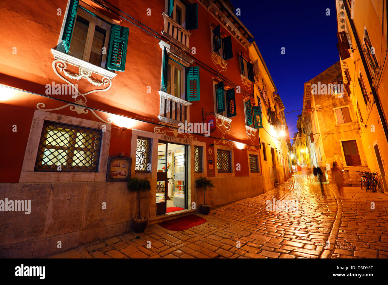 Old street in Rovinj town at night in Istria, Croatia Stock Photo