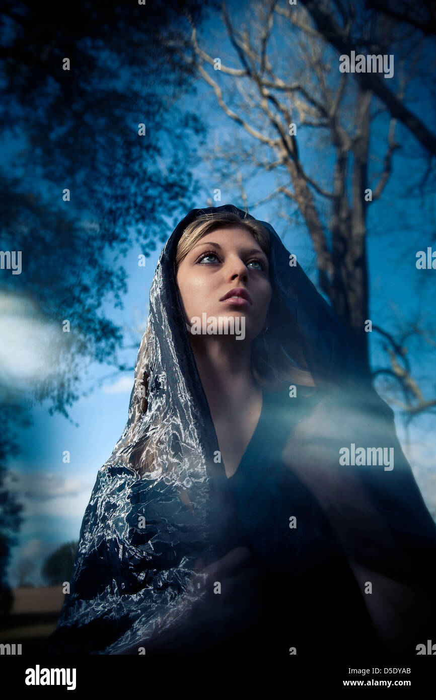 Woman wearing scarf over head fashion portrait Stock Photo