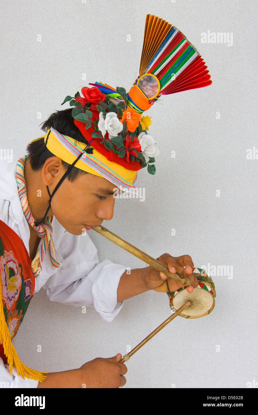 Volador dancer playing drum and flute at Carnival, Veracruz, Mexico Stock Photo