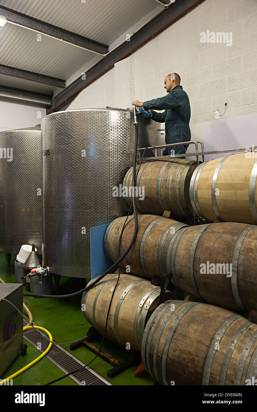 Cleaning stainless steel containers used to make wine, La Mare estate