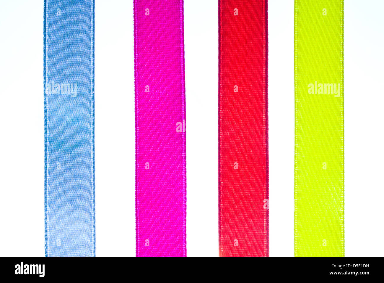 Red, yellow, orange, blue shiny gradient curling ribbons for design