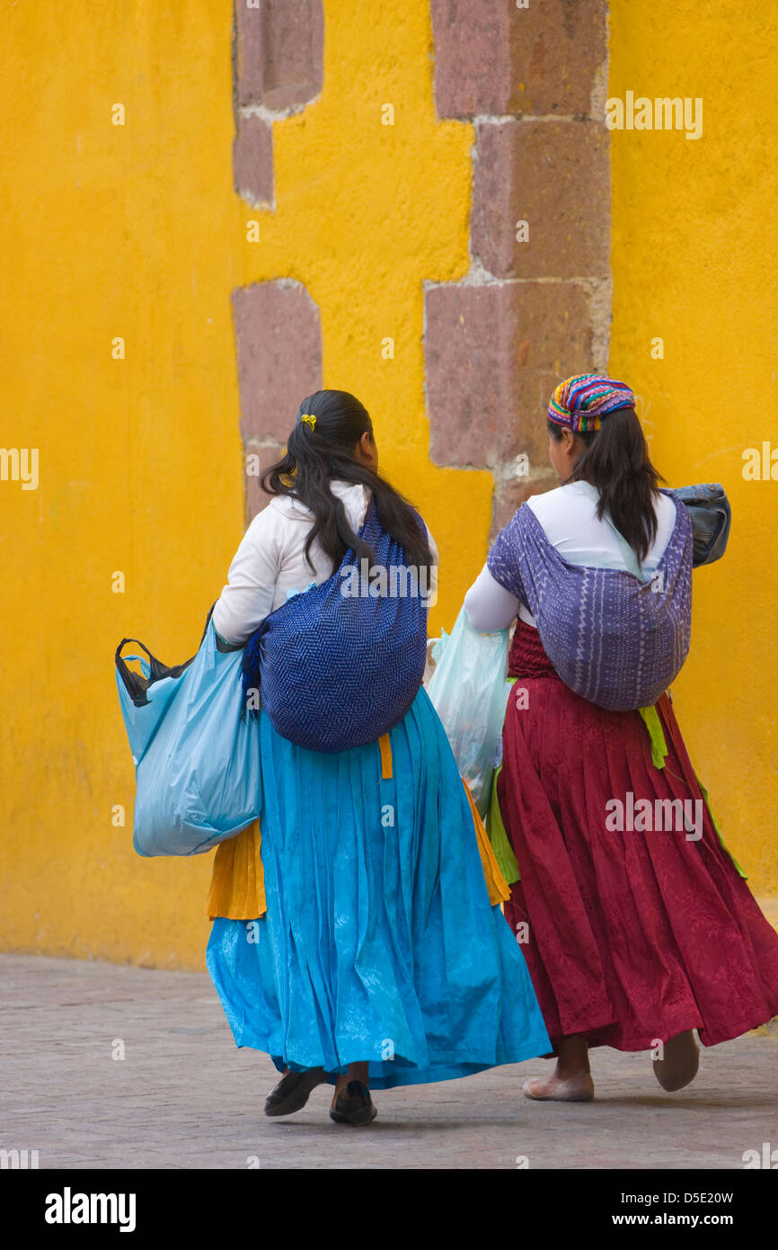 Mexican woman with yellow wall, San Miguel de Allende, Mexico Stock Photo