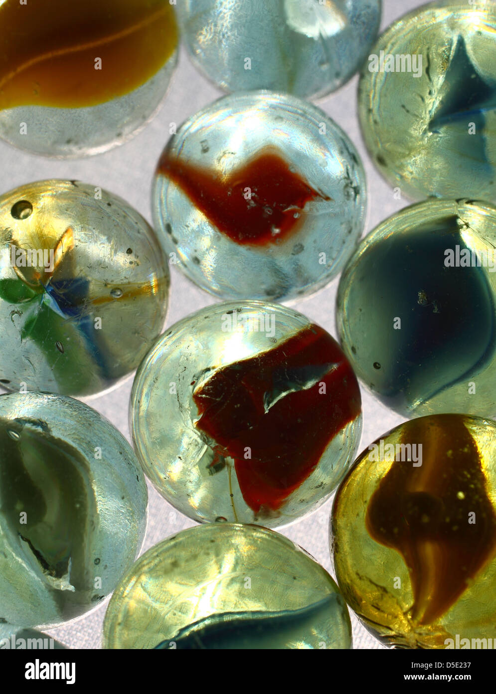 Colourful marbles on a white background Stock Photo - Alamy